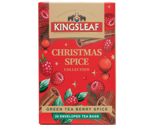 Herbata Kingsleaf Green Tea Berry Spice w świątecznym czerwonym opakowaniu z malinami i przyprawami.