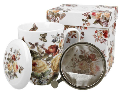 Zestaw: kubek porcelanowy Zahra 380 ml, pokrywka i zaparzacz, zaprezentowany obok ozdobnego pudełka.