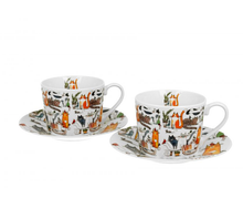 Dwie porcelanowe filiżanki ze spodkami w zabawny wzór kotów.