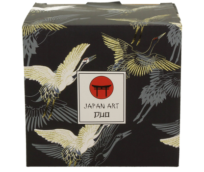Eleganckie pudełko z orientalnym motywem żurawi na czarnym tle.