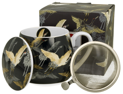 Zestaw kubka Żurawie Nocą z zaparzaczem, pokrywką i ozdobnym opakowaniem.