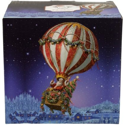 Ozdobne pudełko z motywem świątecznym przedstawiającym Mikołaja w balonie, dopasowane do porcelanowego kubka.