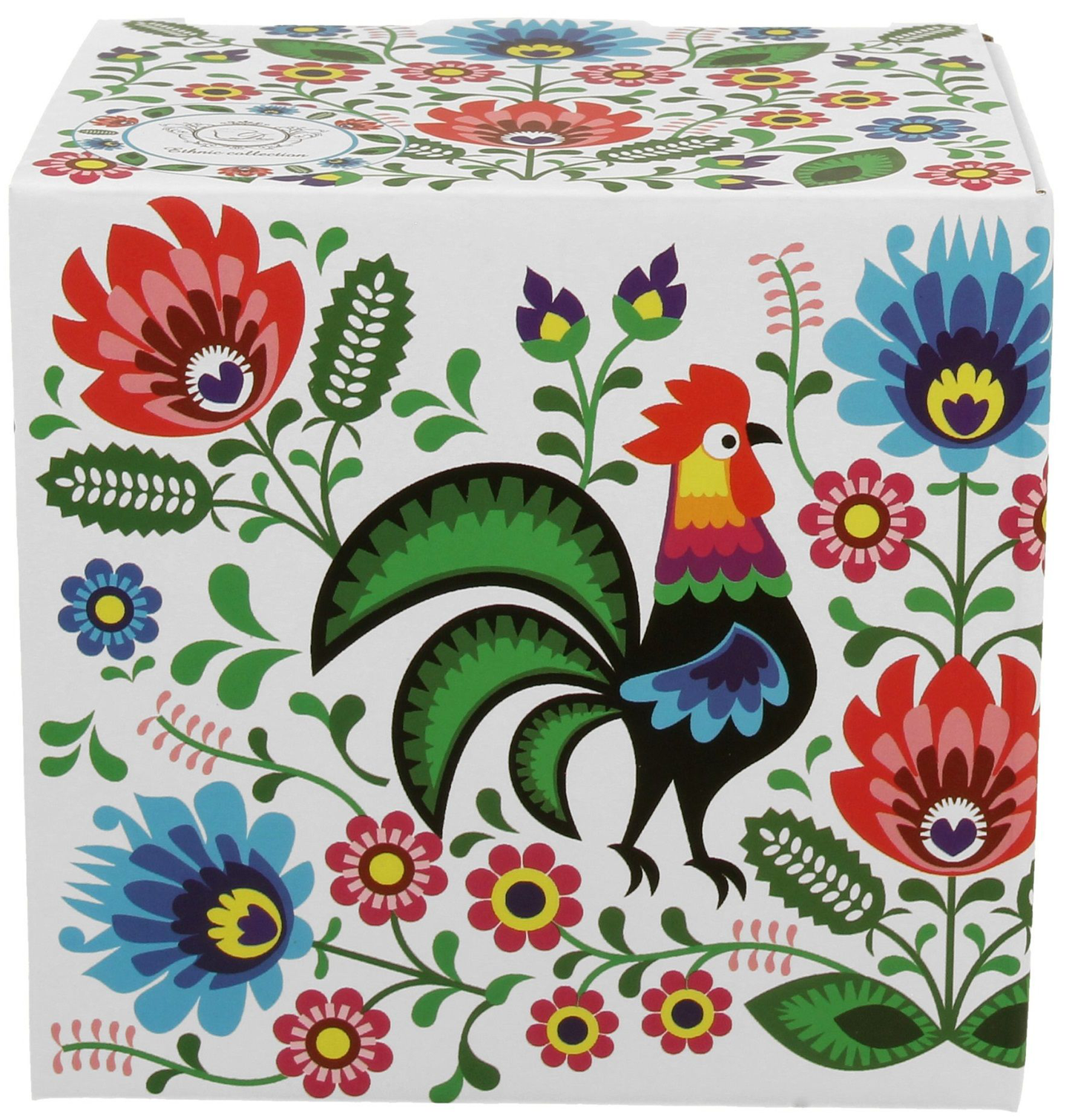 Pudełko prezentowe z kolorowym motywem folkowym i kogutem, w którym zapakowany jest kubek porcelanowy.