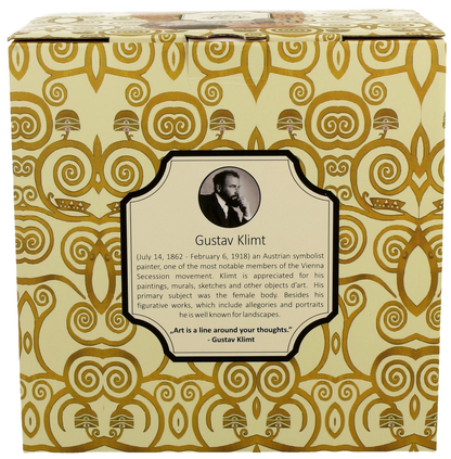 Eleganckie pudełko prezentowe z wizerunkiem Gustava Klimta i złotymi wzorami w stylu secesyjnym.