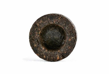 Pojedynczy sprasowany krążek herbaty Pu Erh MINI Tuo Cha.