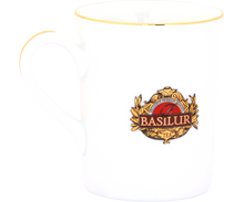 Kubek Basilur z uchwytem, wykonany z białej porcelany ze złotym wykończeniem.