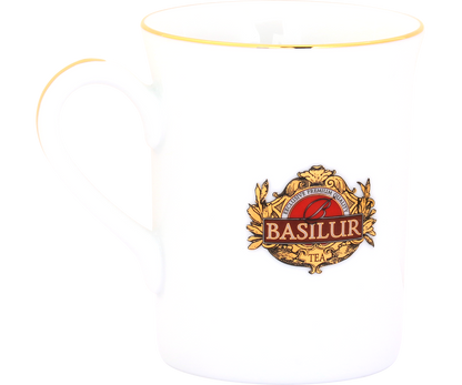 Kubek Basilur z uchwytem, wykonany z białej porcelany ze złotym wykończeniem.