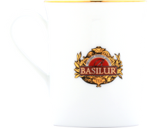 Elegancki porcelanowy kubek Basilur z logo i złotym rantem.