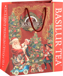 Torba prezentowa świąteczna Basilur z motywem Mikołaja i choinki w czerwono-złotej oprawie.