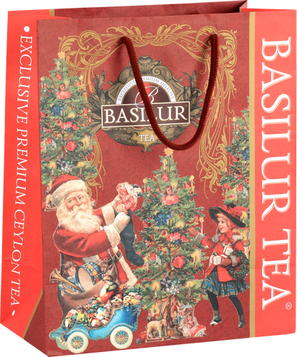 Torba prezentowa świąteczna Basilur z motywem Mikołaja i choinki w czerwono-złotej oprawie.