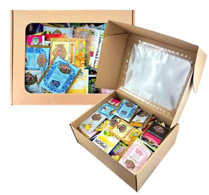 Kartonowy ekspozytor z przezroczystym okienkiem, wypełniony saszetkami herbat Basilur i innych marek.