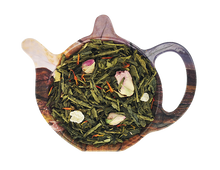 Zielona herbata Sencha Różany Ogród z ananasem kandyzowanym, rodzynkami, pączkami róż i saflorem w dekoracyjnej podstawce – aromatyczna herbata zielona.