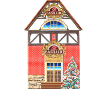 Front puszki Basilur Winter Avenue IV – czerwony domek z choinką i logo Basilur.